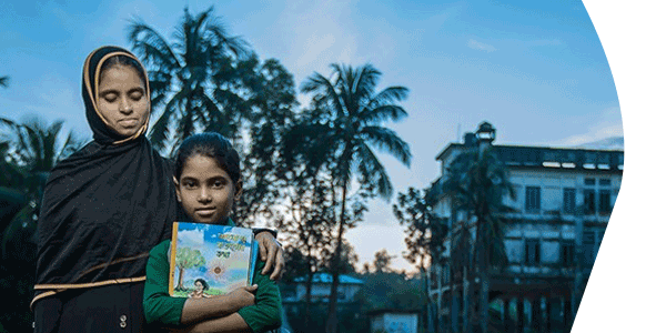 Mother and child with book in Bangladesh