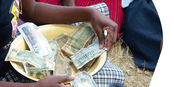 image of women counting money in a basket