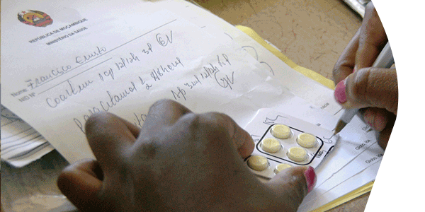 A health provider in Natite, Mozambique, writes up the drug dosage for uncomplicated malaria