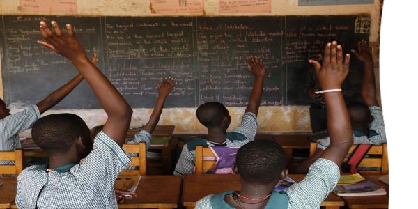 School children raising their hands