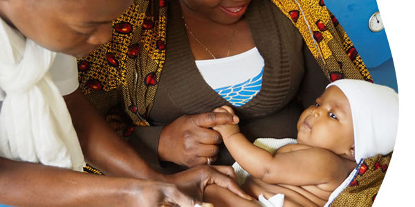 mother providing medicine to child