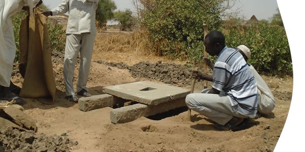 image of people building a latrine